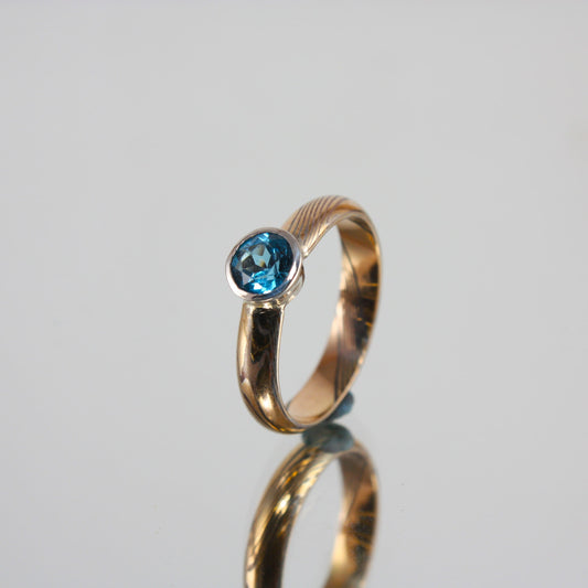 Gold-Mokume-Ring-with-Blue-Topaz