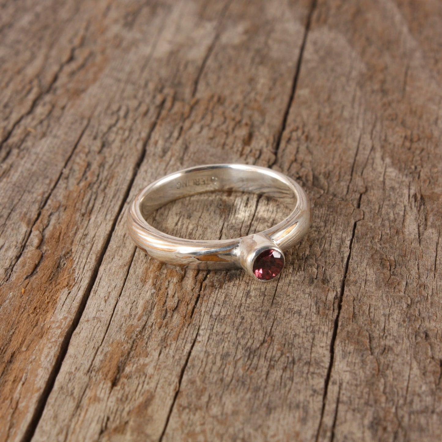 bronze mokume ring with rose zircon..