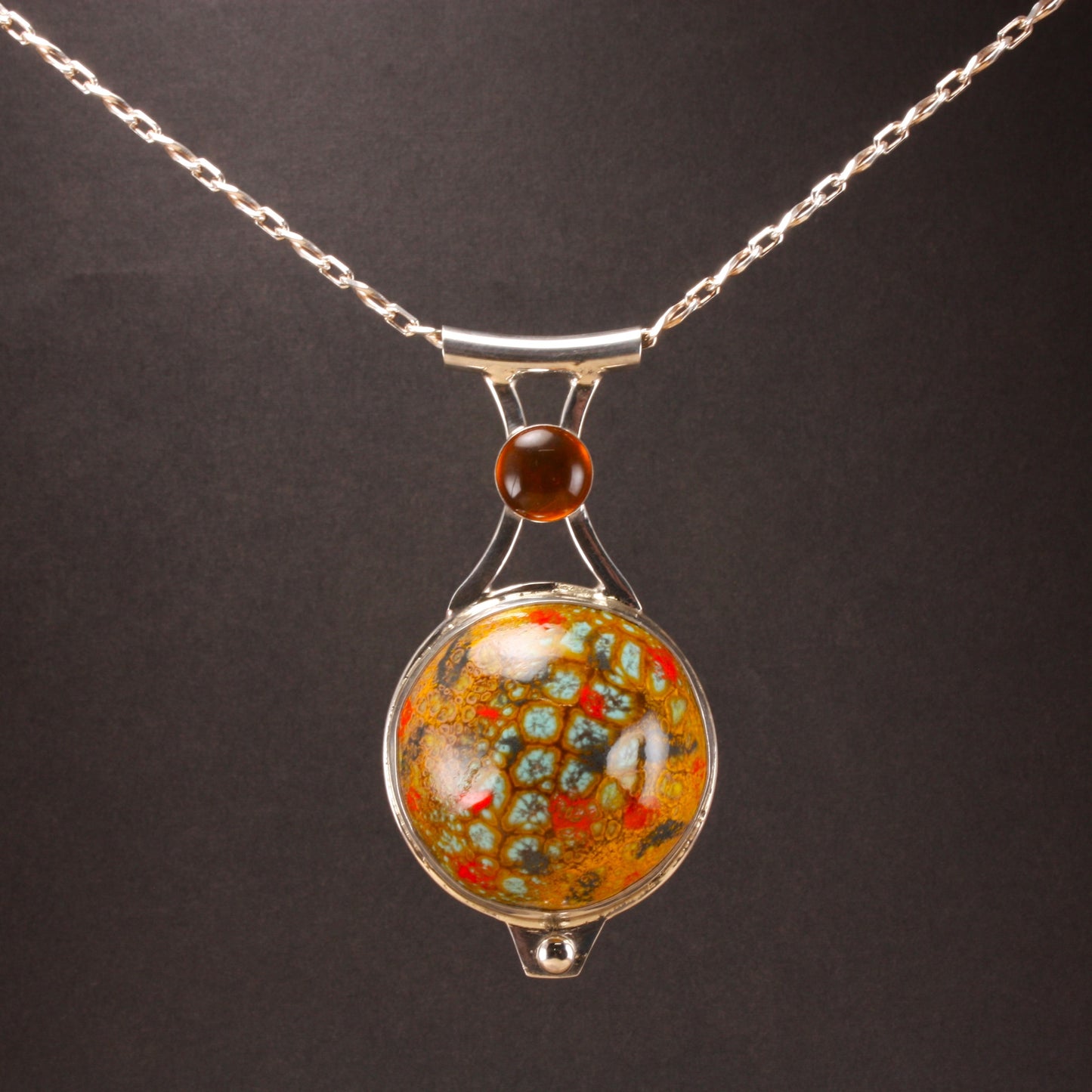 large enamel pendant with amber..