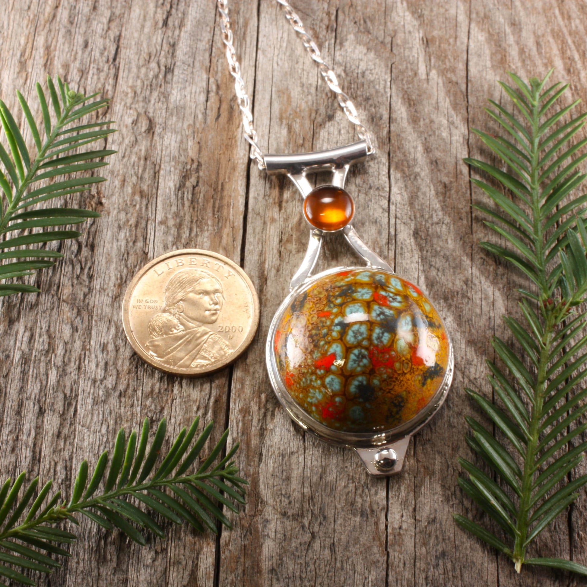large enamel pendant with amber.
