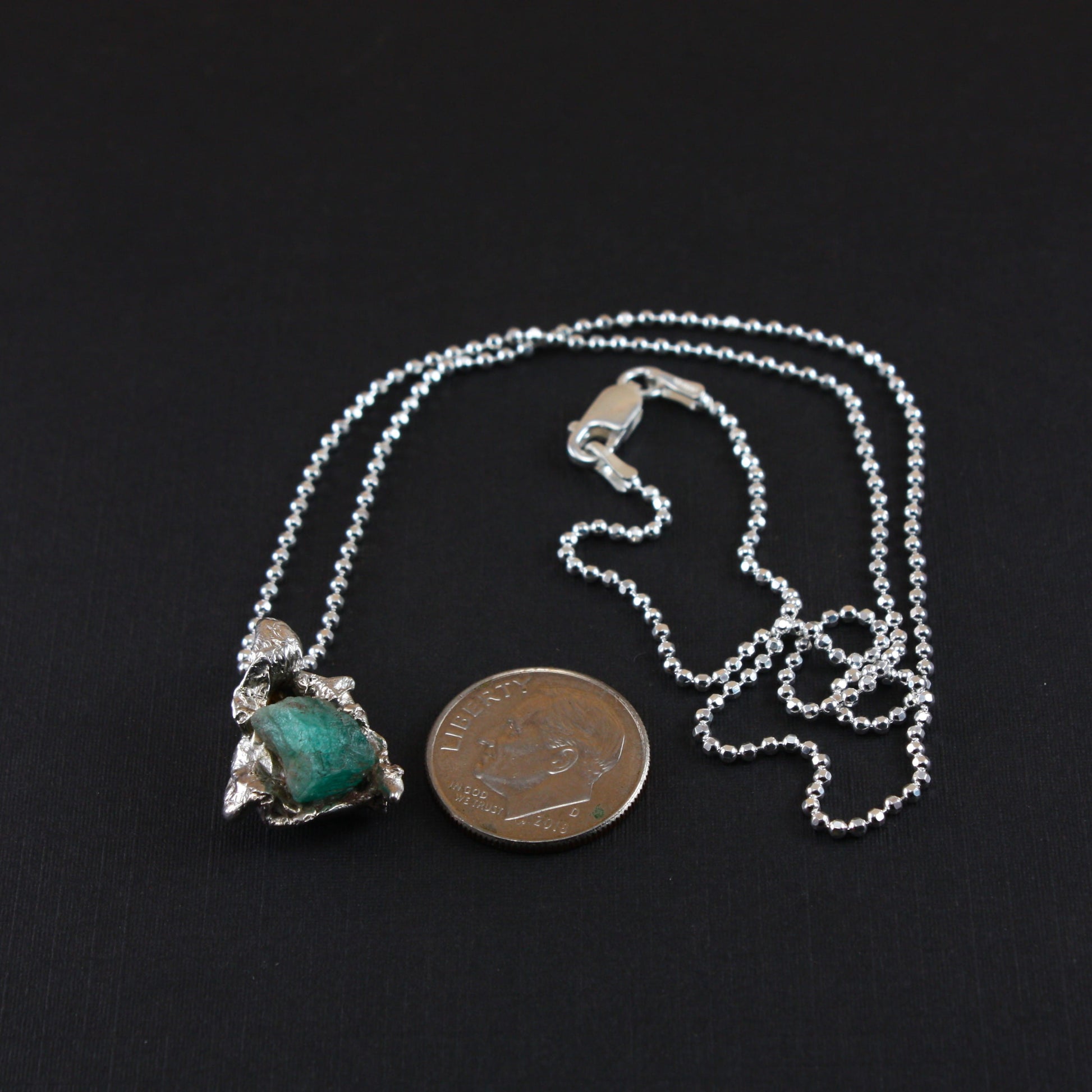 Water-Cast-with-Emerald-Necklace