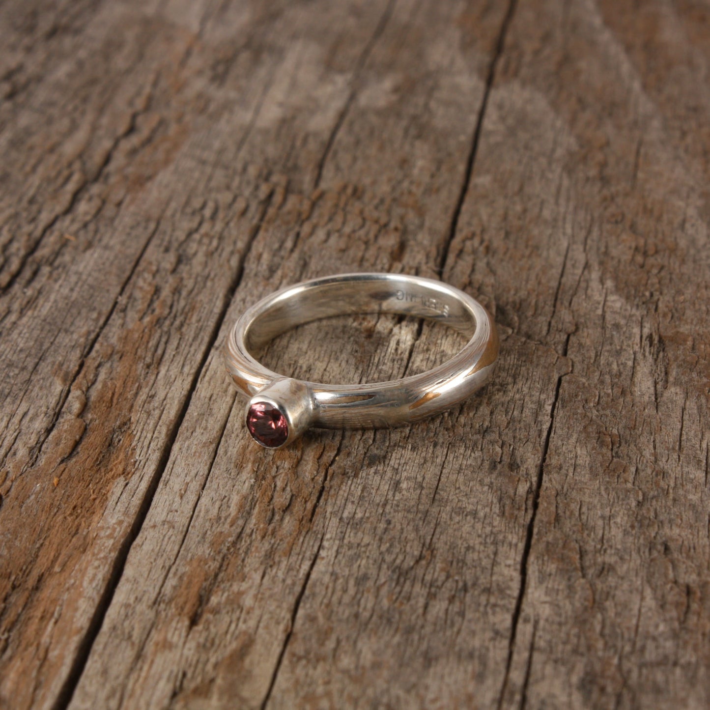 bronze mokume ring with rose zircon.