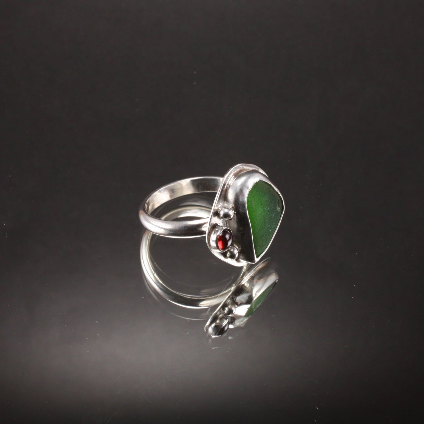 green sea glass ring with garnet...