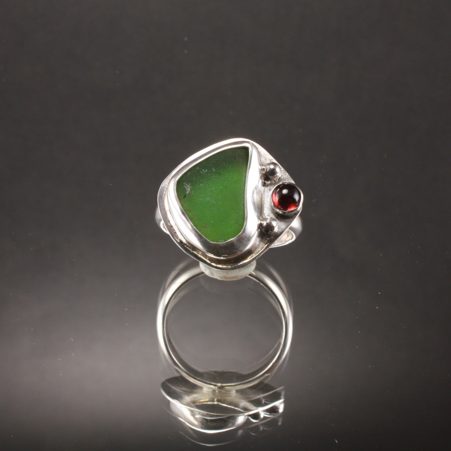 green sea glass ring with garnet