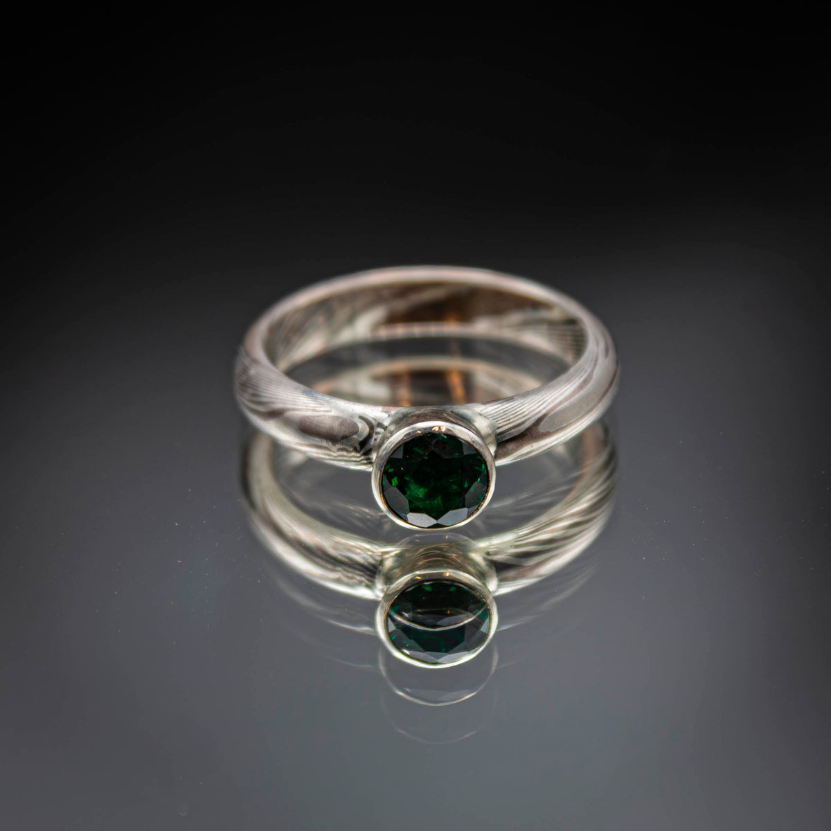 shibuichi mokume ring with emerald..