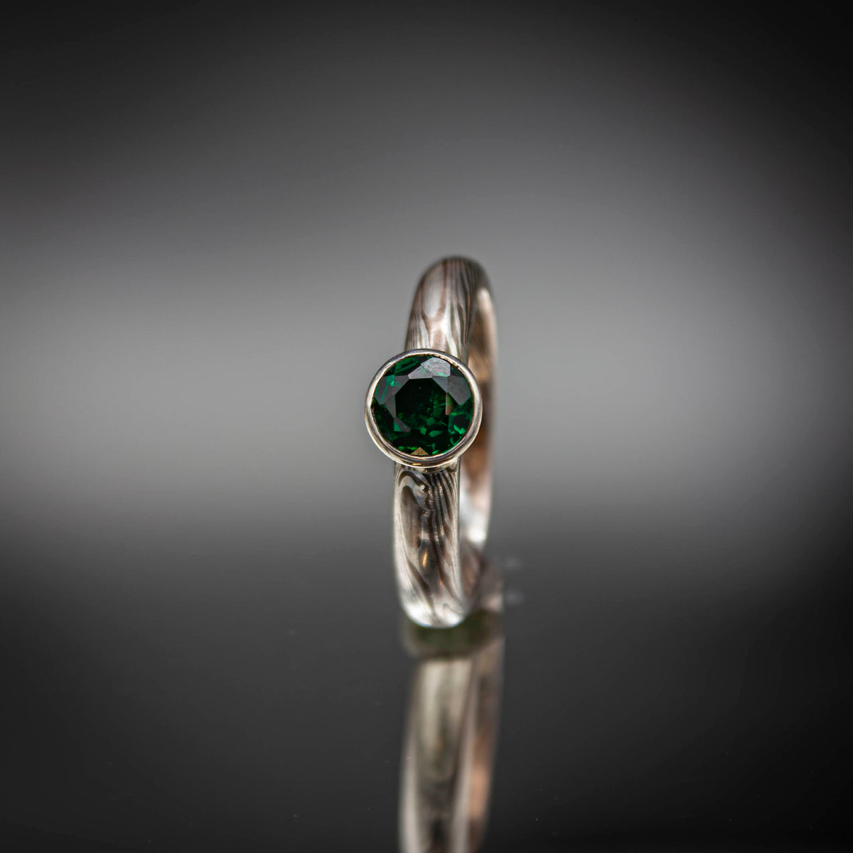 shibuichi mokume ring with emerald