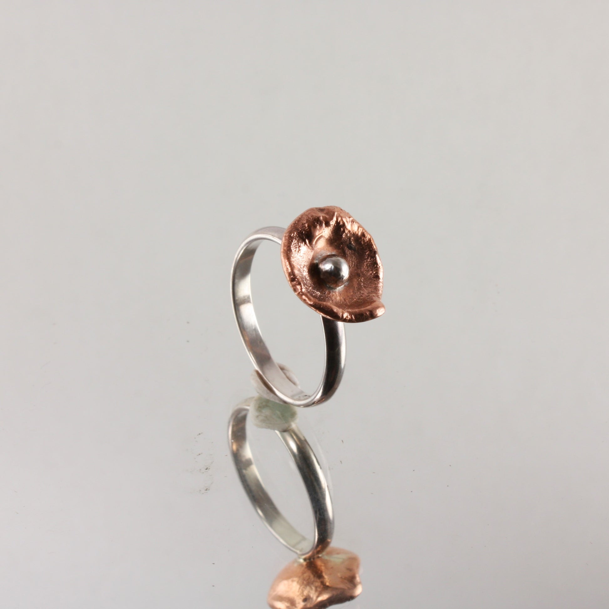 water cast copper and silver ring.