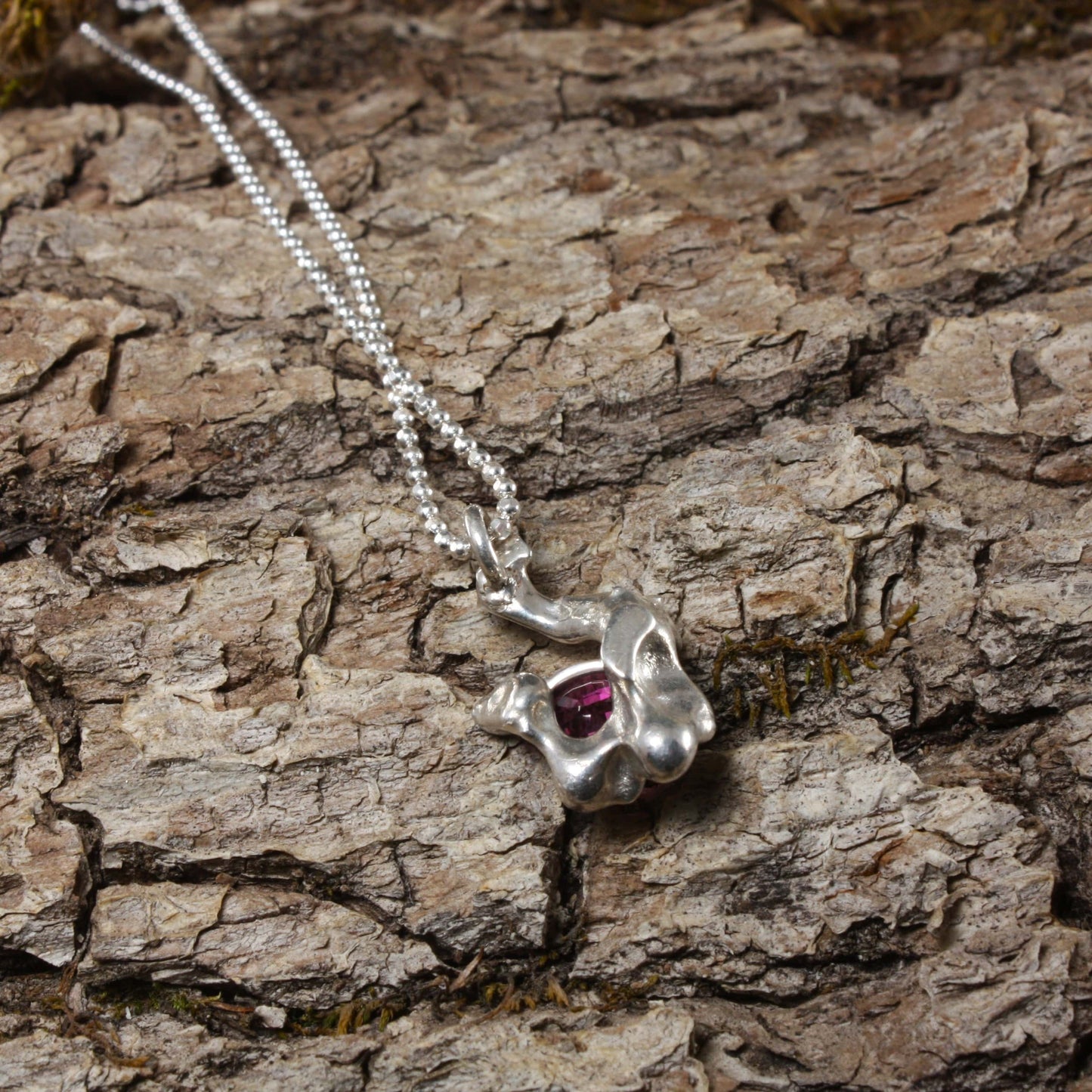 water cast necklace with garnet..