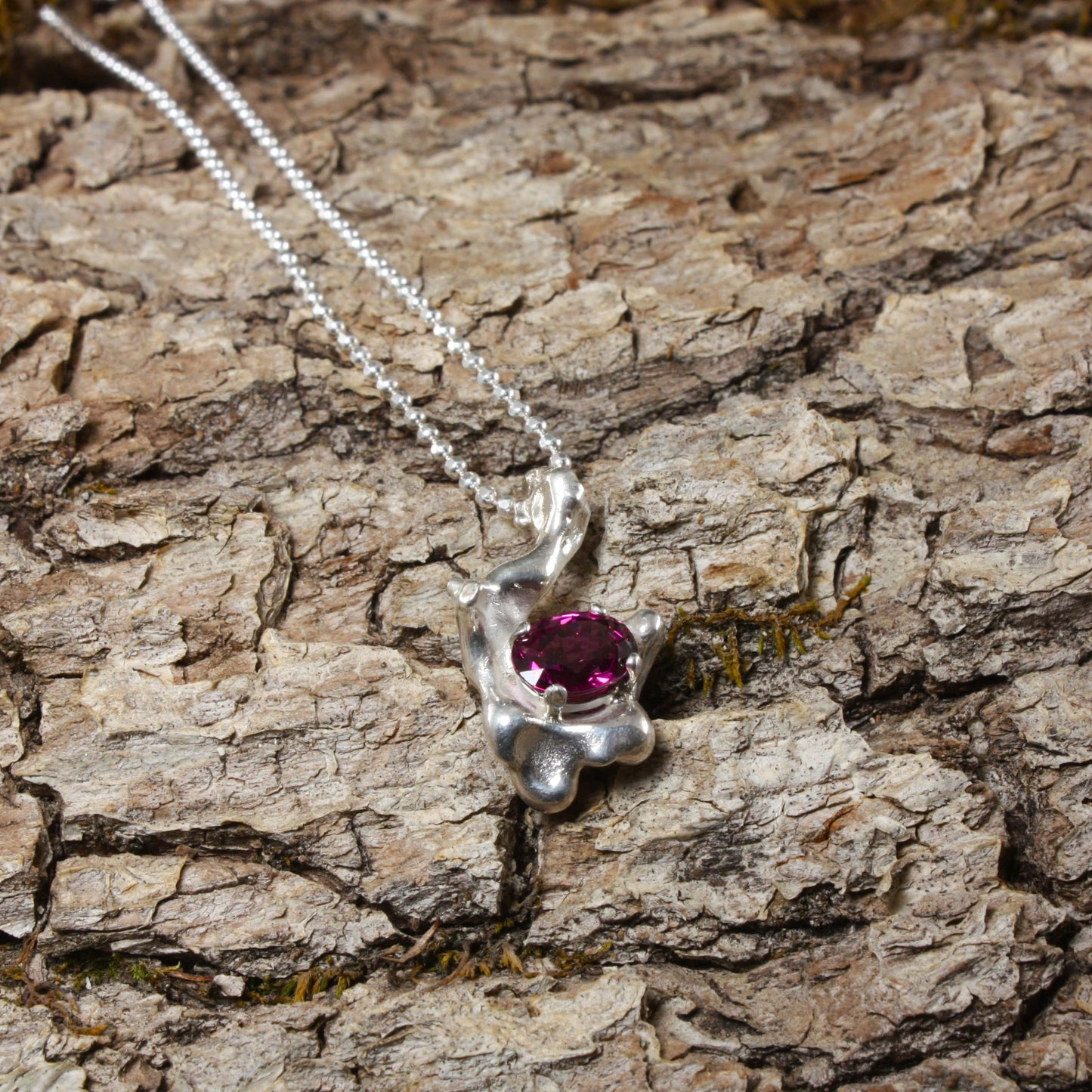 water cast necklace with garnet.