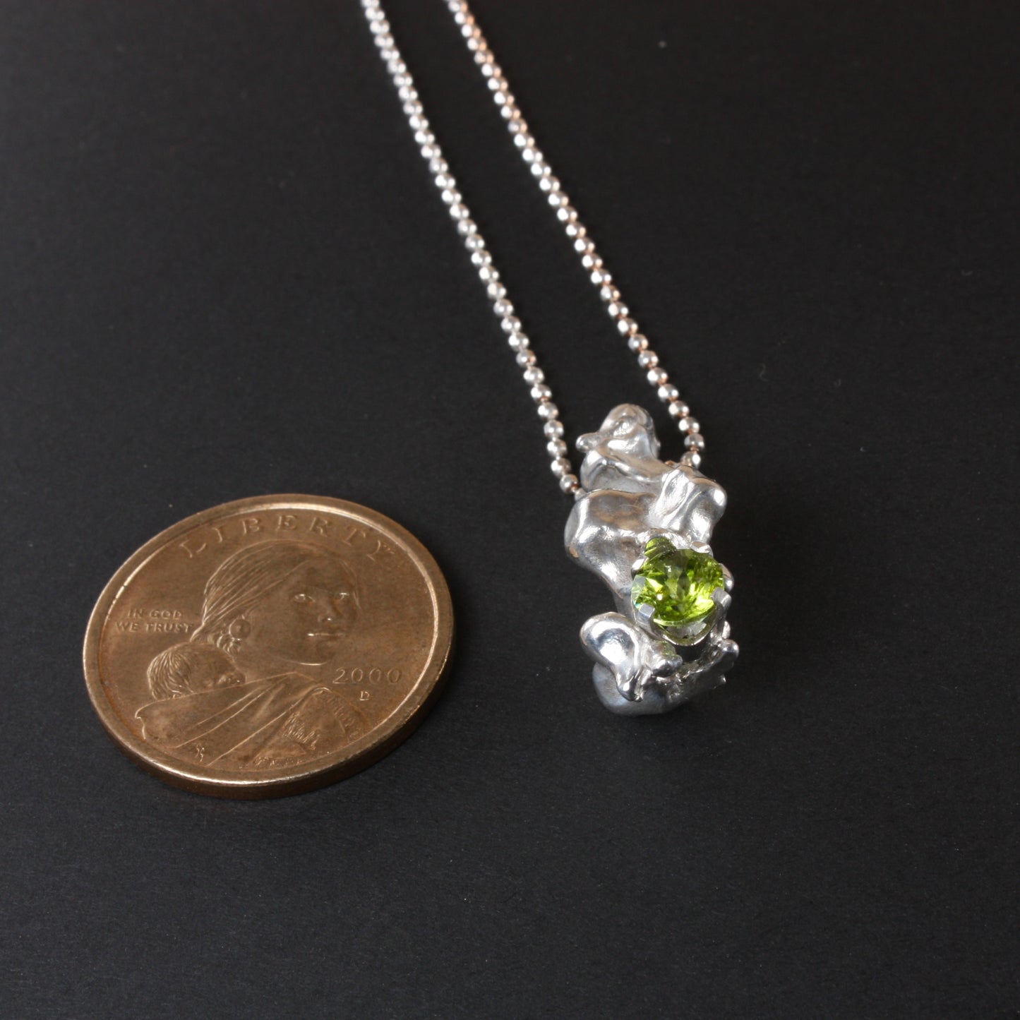 water cast silver necklace with peridot....