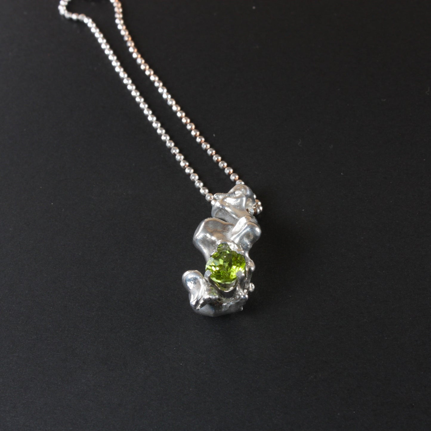 water cast silver necklace with peridot...