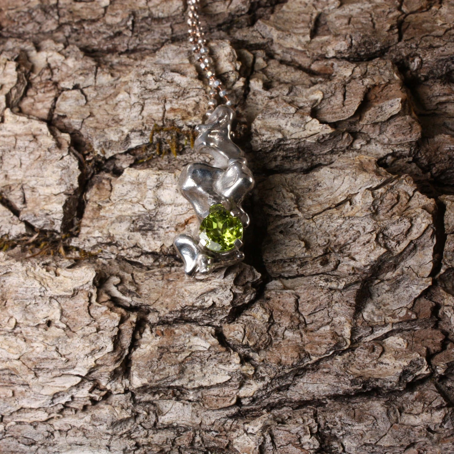 water cast silver necklace with peridot..