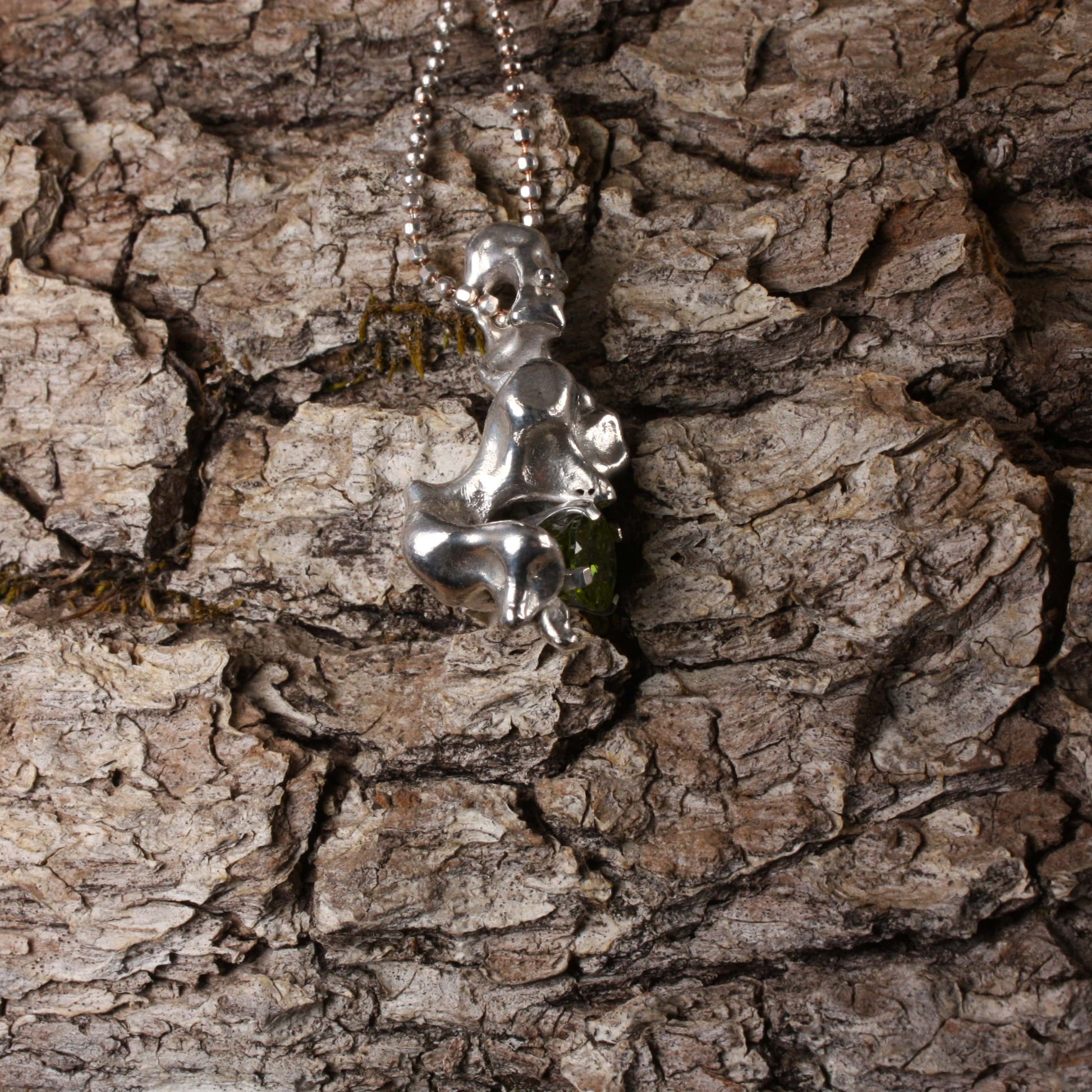 water cast silver necklace with peridot.